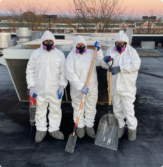 Keys Environmental Services crew, performing asbestos abatement on roof